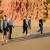 A family walk on the beach.